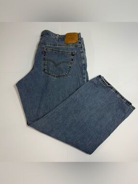 Vintage Levi's 577 Light Blue Denim Jeans with Leather Patch 22W